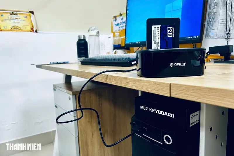Close-up of a high-speed portable SSD connected to a computer