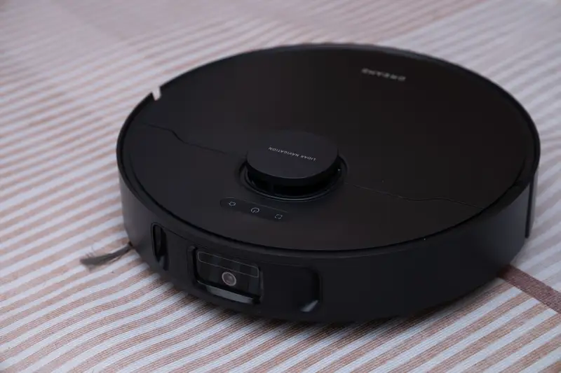 Underneath view of a robot vacuum brush system