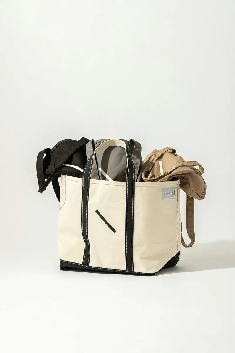 Detail view of Saturdays NYC L.L. Bean tote handles and stitching